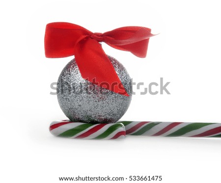 Silver Christmas ball and striped candy
