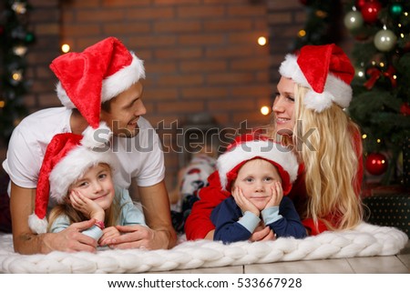 Couple with children on plaid