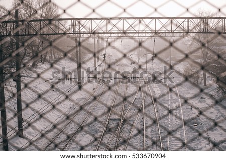 Railway covered with snow.Railroad winter morning.Railroad tracks in winter.The image of a winter view of the railroad tracks