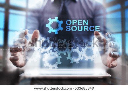 Businessman using tablet pc and selecting open source.