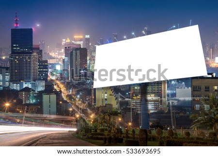 double exposure of blank billboard for advertisement at twilight time with light trails on the road at dusk 