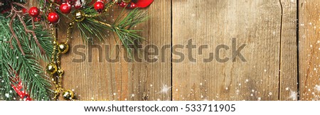 Christmas and new year background. Tree fir snow candy and decor on wooden table. Top view with copy space, border design panoramic banner