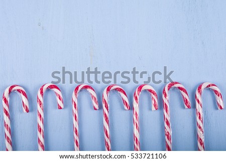 Ã�Â¡andy canes on a wooden background. Christmas sweets and decorations