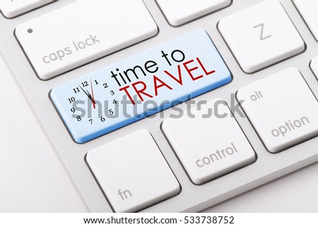 Time to travel written on computer keyboard.