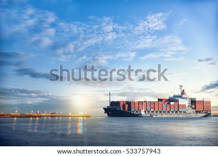 Logistics and transportation of International Container Cargo ship in the ocean at twilight sky, Freight Transportation, Shipping Royalty-Free Stock Photo #533757943
