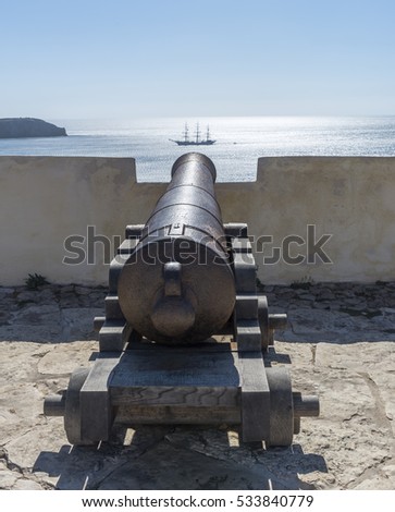 Algarve, Portugal - Cannon aimed at sailing ship