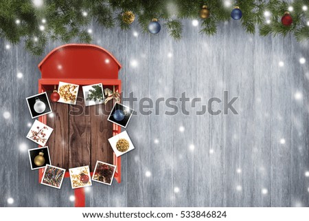 Christmas ball in the red telephone box on gray background.