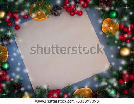 Greeting card on wooden background with Christmas decorations,toning.