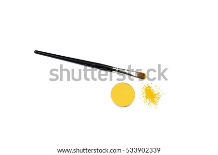brush for correction of eyes in a yellow pigment.