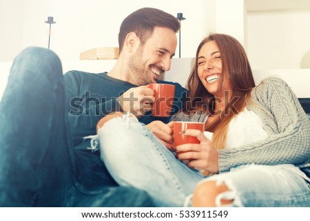 Cheerful young couple in the morning at home. Royalty-Free Stock Photo #533911549