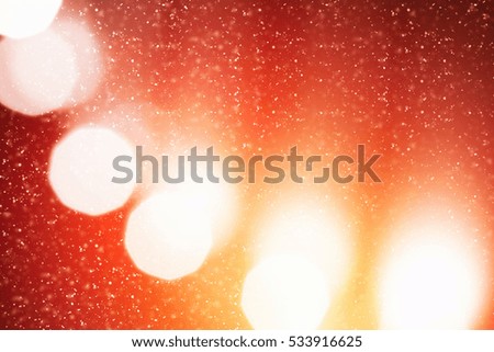 Red  Abstract Christmas Background with Golden circle glitter or bokeh lights. Round gold defocused particles