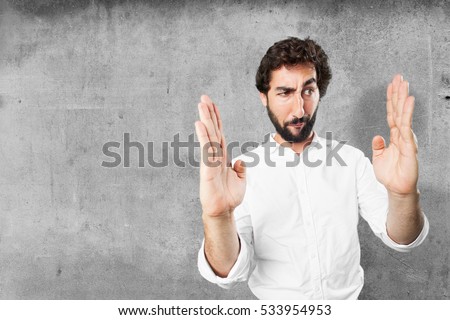 young funny man showing gesture. surprise expression