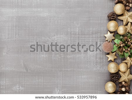Christmas decoration yellow and green on wooden background.Toys.Stars.Balls
