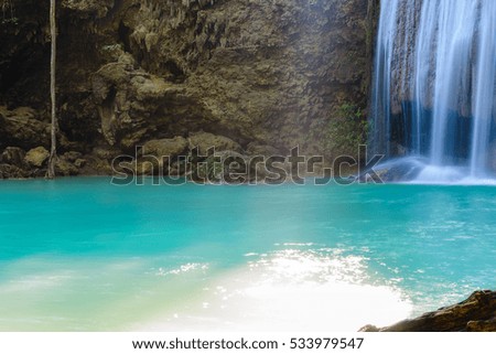 Waterfall in deep forest at Erawan waterfall National Park Kanjanaburi Thailand