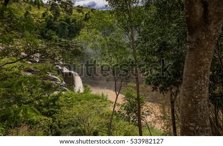 Nature landscape of waterfall in Vietnam.waterfall in mountain forest under great sky.Adventures and travel concept.Scenic landscape.beautiful place.wild nature.
