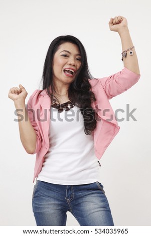  success business woman celebrating screaming and dancing of joy winning