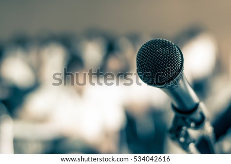 Microphone voice speaker in seminar classroom, lecture hall or conference meeting in educational business event for host, teacher, or coaching mentor  Royalty-Free Stock Photo #534042616