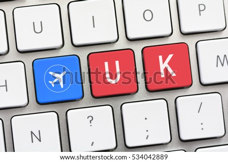 UK writing on white keyboard with a aircraft sketch