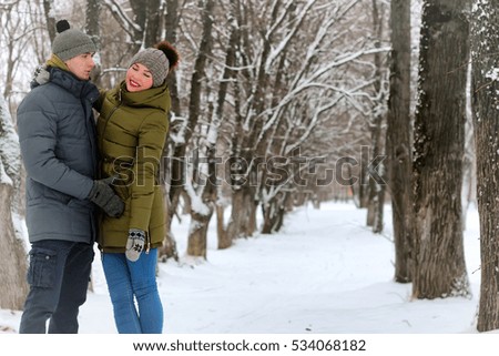 young lovers walk smile winter