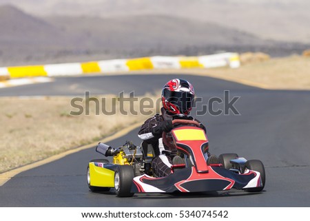 Adult Go Kart Racer on Track Royalty-Free Stock Photo #534074542
