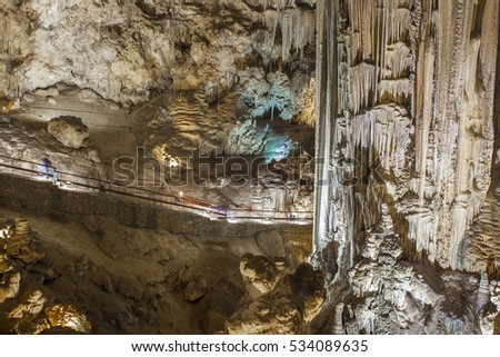 Unidentified visitors in the Famous Magnificent Nerja Caves, Andalusia, Spain