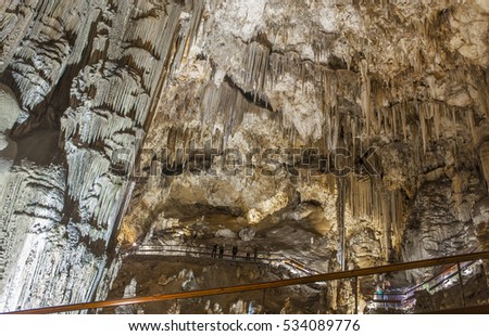 Unidentified visitors in the Famous Magnificent Nerja Caves, Andalusia, Spain