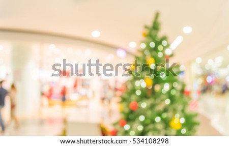 abstract blur image of shopping mall and people on christmas time.