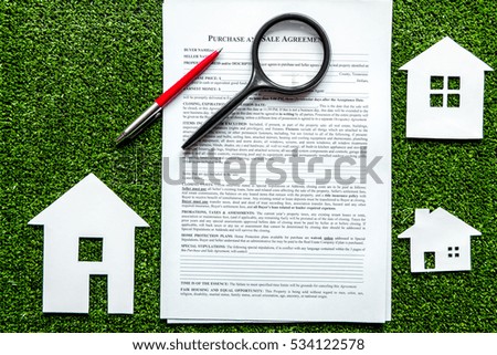 concept of buying house on green background top view