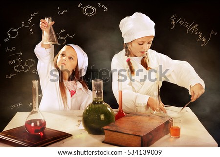 Girls girlfriend playing chemists, conduct experiments
