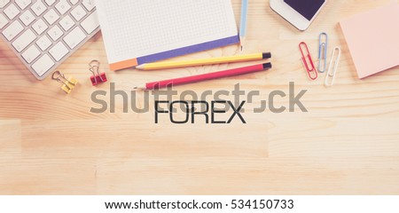 Business Workplace with  FOREX Concept on Wooden Background