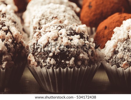 Set of different kinds of homemade chocolate truffles. Selective focus. Shallow depth of field. Toned.