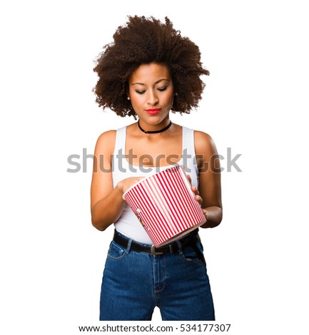 young black woman holding a popcorn bucket