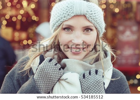 urban portrait of woman in winter clothes