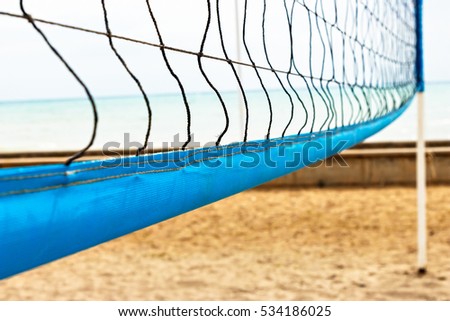 Beach volleyball net close up. Horizontal image. Royalty-Free Stock Photo #534186025