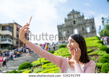 Woman taking self image in Macau city