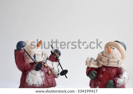 Christmas decoration background with figurine snowman on skis