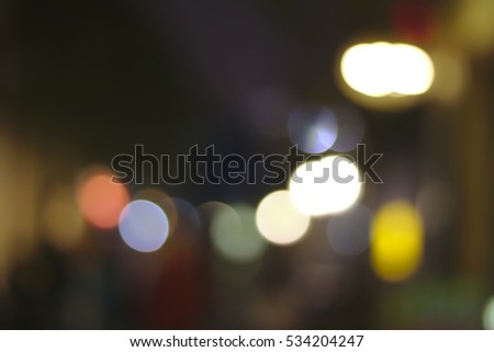 Colorful glitter abstract with blurry background  and shiny of Christmas lights glow on street night