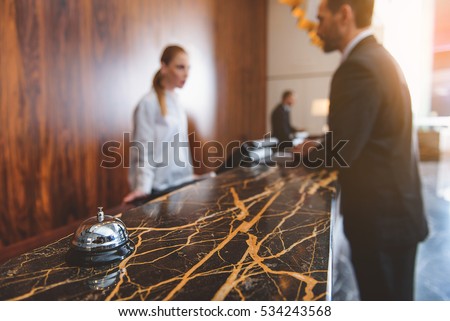 Registration desk in modern hotel Royalty-Free Stock Photo #534243568