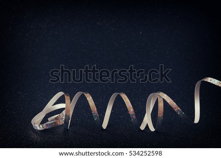 Abstract image of christmas festive ribbon with glitter background