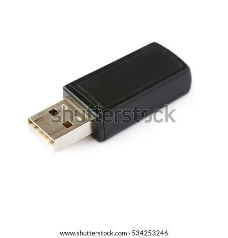 Black flash drive or wireless receiver isolated over white background