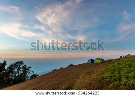 Camping and tent in the mountain with sunrise. Camping tent in top of mountain with sunrise.