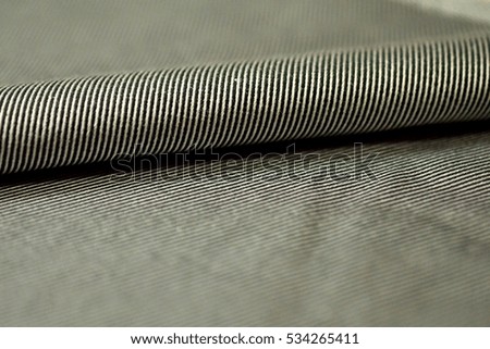 close up roll stripe gray and black fabric of shirt, photo shoot by depth of field for object
