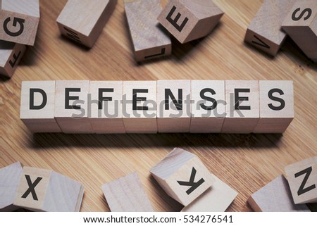 Defenses Word Written In Wooden Cube