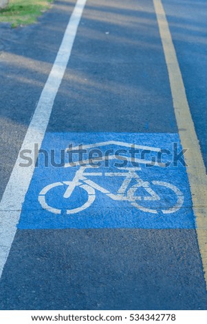 Bicycle path,Bike lane signs painted onto.
