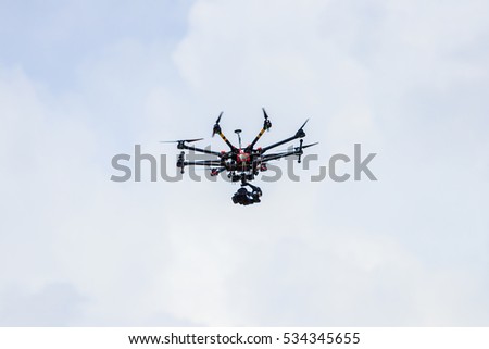Professional photography drone with the camera flying