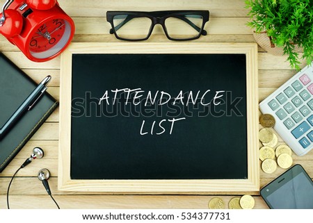 Top view of earphone, notebook, pen, alarm clock, spectacle, small green tree, calculator, coins, smartphone and black chalkboard written with ATTENDANCE LIST inscription on wooden table.