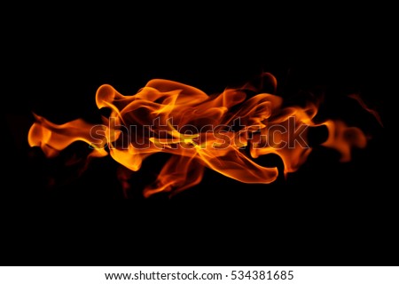Fire flames on black background Royalty-Free Stock Photo #534381685