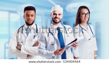Experienced doctors in operating room. Light background