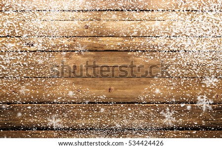 wooden background with snowflakes Royalty-Free Stock Photo #534424426