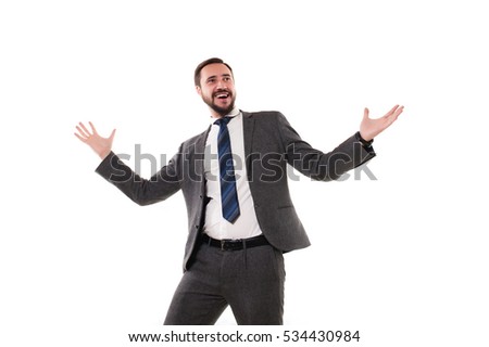 Business man throwing fists in air and smiling while celebrating